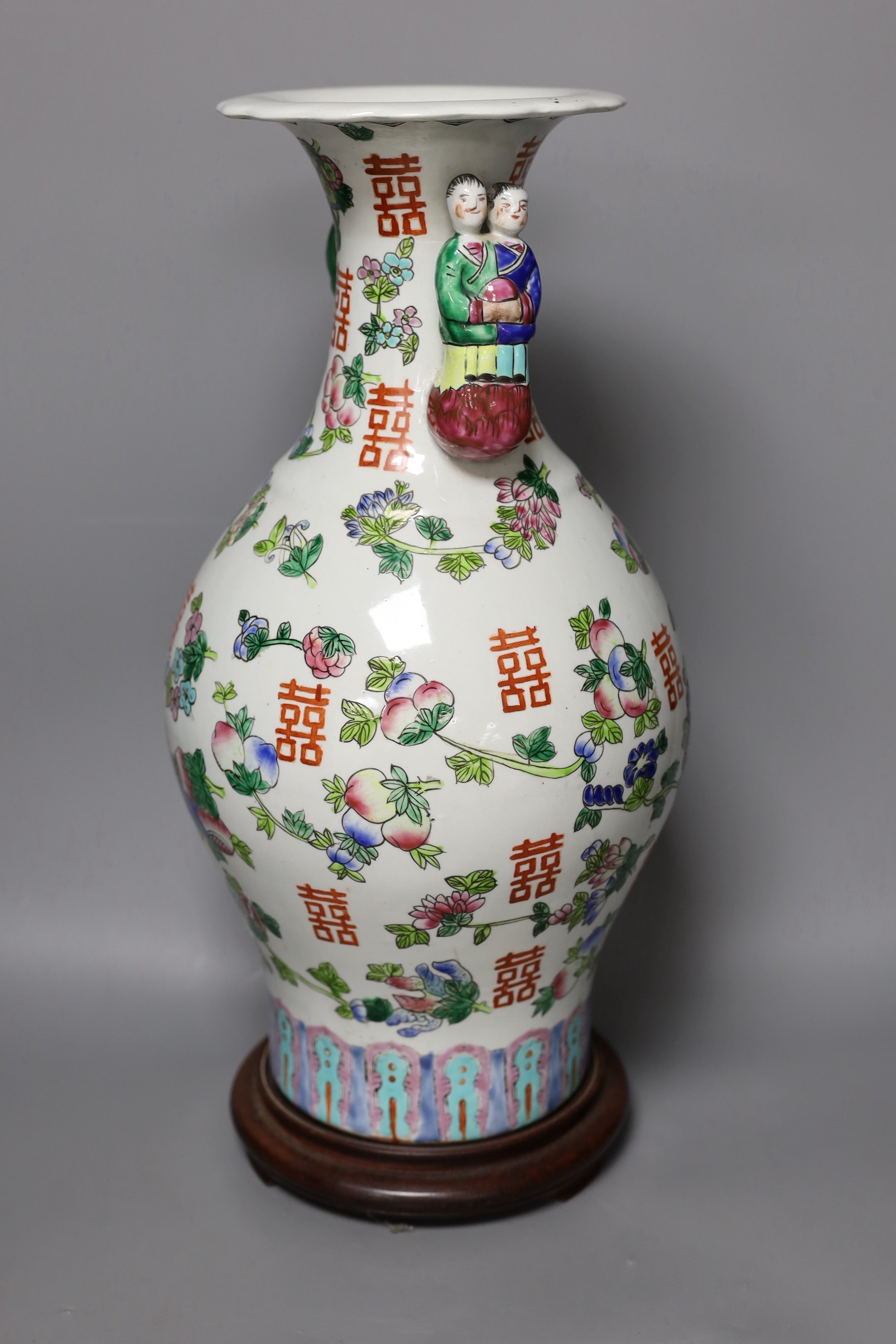 A Chinese famille rose vase, on plinth, 46 cms high